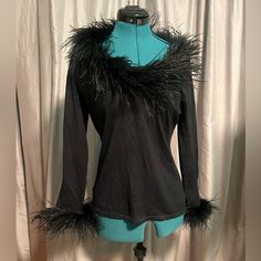 Natorious Black Feathered Blouse Size Small Nwot. Bust Is 17” Across, Length Is 23.5”. Lots Of Stretch! Super Cute And Fun. Never Worn; Excellent Condition. Smoke Free Home. Make An Offer! Long Sleeve Tops With Feather Trim For Evening, Long Sleeve Tops With Feather Trim For Fall, Fitted Tops For Fall Costume Party, Winter Party Top With Feather Trim, Winter Party Tops With Feather Trim, Fitted Tops With Feather Trim For Winter, Black Feather Trim Top For Evening, Stretch Tops For Costume Party In Fall, Stretch Tops For Fall Costume Party