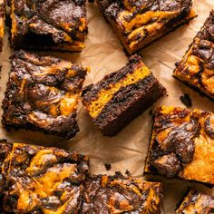 some brownies are cut into squares and stacked on top of each other