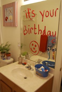 a bathroom with a birthday message on the mirror