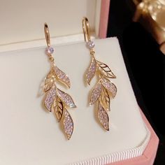 These Elegant Leaf Dangle Drop Earrings Are Perfect For Any Outfit. This Design Is Sleek And Modern Yet Classic And Elegant Style, Well Matched For Dress, Appointment, Daily, Wedding And Any Other Occation. Perfect Gift: This Earrings Will Be A Special Gift For Friends, Wife, Daughter, Mother, Sister, Perfect Gift For Christmas, Graduation, Birthday, Thanksgiving Day, Anniversary, Graduated Day, Mother's Day. Material: Alloy/Cubic Zirconia Size: 2.0"X0.4" Color: Gold