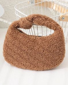 Keep those hands warm and toasty with this cozy tote. Made of sherpa shearling material, it features contrasting faux fur trim. Its neutral colors add versatility and makes it perfect for any outfit, from evening to casual. Color : Brown Size : 10.6" X 5.9" Material : 100% Polyester Top Zip Closure Top Carry Handle Lined Mini Handbags Leather, Sherpa Bag, Teddy Bag, Winter Tote, Tiny Purse, Faux Fur Bag, Glitter Bag, Vintage Coach Bags, Fur Bag