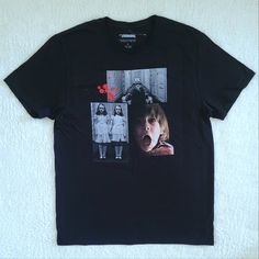 Brand New Without Tags (Plastic Swift Tack Still Attached) The Shining Graphic Tee Unworn, Excellent Condition With No Flaws Size Large Approx Measurements Laying Flat Length 29.5" Armpit To Armpit 21" Across Bottom Hem 22" 100% Cotton Color Of Tee Is Black With A Graphic On Front Of Three3 Movie Still Shots: Creepy Twins Alexie And Alexa Grady Danny Torrance Riding His Tricycle Toward The Creepy Twins Danny Torrance With A Complete Look Of Horror On His Face "The Shining" In Red On Upper Back C Creepy Twins, Danny Torrance, The Shining, Tricycle, Warner Bros, Graphic Tee, Swift, Twins, Graphic Tees