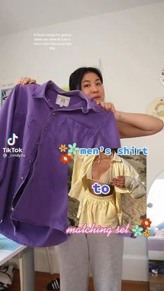 a woman is holding up a purple shirt