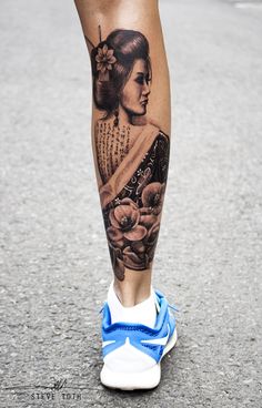 a woman's leg with a tattoo on it