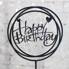 a happy birthday cake topper with the words happy birthday written in black on it