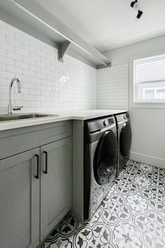 a washer and dryer in a small room