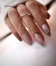 a woman's hand with some manies and rings on her fingers, while she is