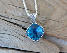 "London blue topaz necklace...1 1/8\" tall with bail by 5/8\" wide at the widest spot, cast in sterling silver 925 with a beautiful 14mm by 14mm cushion cut London blue topaz stone...the chain is 18\" with a lobster catch also in sterling silver 925....last picture shows the back of the necklace" Sterling Silver Cushion Cut Necklace, Silver Blue Topaz Cushion Cut Jewelry, Blue Cushion Cut Sterling Silver Jewelry, Silver Topaz Cushion Cut Jewelry, Cushion Cut Sapphire Jewelry In Sterling Silver, Cushion Cut Sapphire Sterling Silver Jewelry, London Blue Topaz Necklace, Blue Topaz Necklace, Topaz Necklace