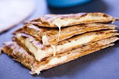 a stack of quesadillas sitting on top of a table