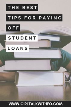 a stack of books sitting on top of a wooden table with text overlay that reads the best tips for paying off student loan