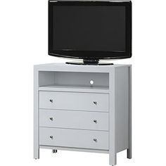 a flat screen tv sitting on top of a white dresser