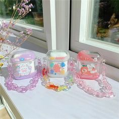 three bags sitting on top of a table next to a window