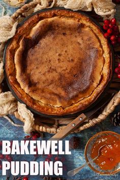 a baked pie sitting on top of a wooden table next to some cranberries