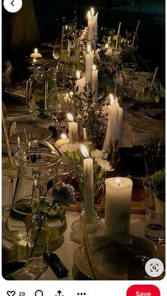 an image of a table setting with candles and flowers in the center, on instagram