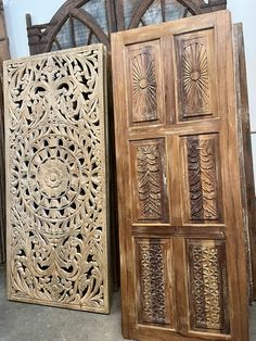 two wooden doors sitting next to each other