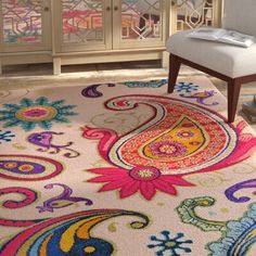 an area rug with colorful designs on it