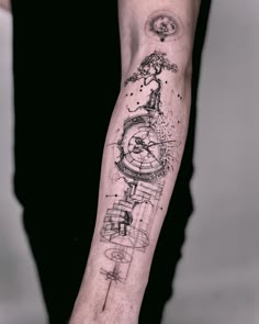 a person with a clock tattoo on their arm