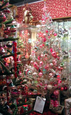 a christmas tree in a store filled with ornaments