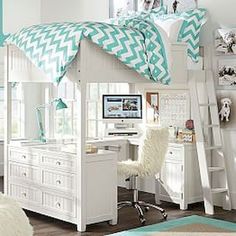 a white bunk bed with a desk underneath it and a computer on the top shelf