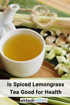 a cup of tea sitting on top of a cutting board next to sliced lemons