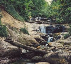 there is a small waterfall in the woods