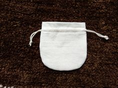 Fancy and stylish round white cotton pouch, custom logo pouch, INDIAN stylish POTLI bags , jewelry gift bags you can use this type of pouches in any occasion like marriage party, ring ceremony, birthday party, and also you can use for giving the gift. size :- 4 x 4 inches (10 x 10 cm) -------------- CUSTOM SIZE ARE ALSO AVAILABLE fabric:- 100% white cotton fabric (20 x 20 sitting) drawstring :- white cotton string you can try with tassel from this link... https://www.etsy.com/in-en/listing/64804 Ring Ceremony, Rings Ceremony, Marriage Party, Cotton Pouch, White Cotton Fabric, Potli Bags, Cotton String, Party Bags, Cute Bags