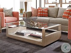 a living room with couches, chairs and tables in the middle of carpeted flooring