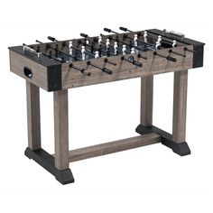 a foosball table with several pieces of equipment on it