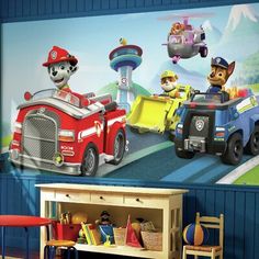 the wall mural in this children's room is painted with paw patrol and firetrucks