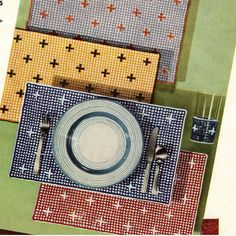 an overhead view of a table setting with place mats and utensils on it