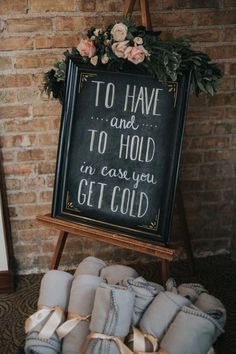 a sign that says to have and to hold in case you get cold with some baby booties