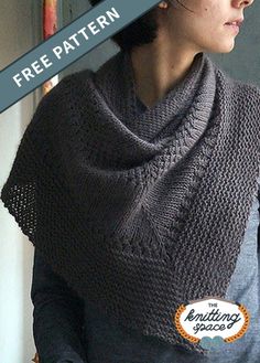 a woman wearing a gray knitted shawl with the words free pattern on it