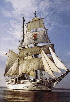 an old sailing ship in the ocean on a sunny day