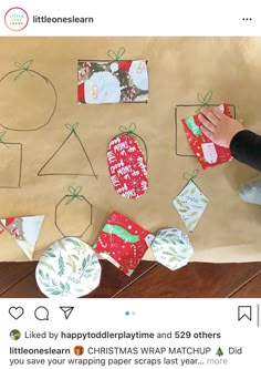 a child is making christmas cards on a brown paper bag