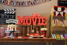 a movie themed birthday party with popcorn buckets