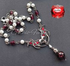 Hello and a warm welcome to my listing. Today I have for you another new addition to my Eternal Lovers Vampire Vial Necklace range. Stunning large open winged pendant set with deep red rhinestones for a touch of sparkle and a small art deco marcasite style bat on the small heart in the centre. Finished on a handmade chain made with glass bead pearls and Czech garnet red faceted glass beads and finished on the back with 2.5mm stainless rolo chain and a stainless lobster clasp.  Suspended from the Goth Birthday, Blood Magic, Bat Jewelry, Vial Necklace, Gothic Vampire, Handmade Chain, Vampire Bat, Necklace Crystal, Birthday Gif