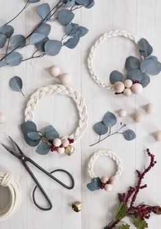 an image of christmas wreaths with scissors and other items on the table for sale