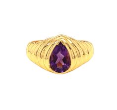 Be bold and beautiful with this stunning 1.75 carat pear-shaped amethyst ring, crafted by Nari Fine Jewels in 14k gold for a luxurious look. Its ribbed texture and fluted edges present a unique and eye-catching statement. Indulge in timeless elegance and undeniable style with this one-of-a-kind piece. It's versatile and can be worn for various occasions, effortlessly paired with different jewelry colors and styles. The face of the ring measures 11.3 mm and sits 5.75 mm high from the finger's surface. The ring is a size 7.   Metal: 14k Yellow Gold Gemstone - Amethyst Gemstone Size - 9 x 6 mm Cut: Pear Total weight: 1.75 carats Finger size  - 7 Elegant Teardrop Amethyst Ring For Formal Occasions, Formal Teardrop Amethyst Ring, Formal Teardrop Amethyst Ring In Fine Jewelry Style, Elegant Teardrop Amethyst Gemstone Ring, Elegant Teardrop Amethyst Ring, Elegant Teardrop Purple Amethyst Ring, Elegant Purple Teardrop Amethyst Ring, Purple Amethyst Teardrop Ring, Teardrop Amethyst Ring For Formal Occasions