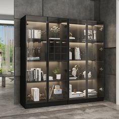 an empty room with glass doors and shelves filled with books, plants and other items