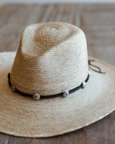 A new Crossbow favorite, brand new for spring 2024. Made with sterling silver sunflower concho buttons thread over genuine deerskin leather. Double wraps around hat and can just be tied for closure. Concho measures 5/8" in size. 8 conchos per band. Handmade by Crossbow in the mountains of Telluride, CO Cheap Brimmed Hat Bands For Rodeo, Cheap Classic Hat Band For Spring, Adjustable Concho Hat For Festivals, Bohemian Concho Hat Bands Adjustable, Bohemian Adjustable Concho Hat Bands, Adjustable Bohemian Concho Hat Bands, Adjustable Western Hat With Concho, Adjustable Southwestern Concho Hat, Southwestern Adjustable Concho Hat