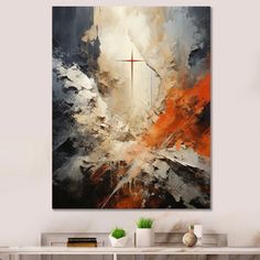 an abstract painting with a cross on it in the middle of a living room area