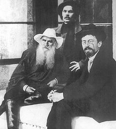 an old photo of three men with long beards