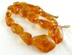 PRODUCT DETAILS LINE 1/CTS 815 TUMBLE BEADS  ALL NATURAL CITRINE  SIZES OF THE BEADS ARE FROM 30MM TO 17MM LENGTH OF THE NECKLACE IS 23 INCHES  AMAZING BIG SIZE AND PERFECT DARK CITRINE COLOR  ATTACHED TO SIZABLE 925 SILVER HOOK NOTE - #You will receive the same product you see in picture. #DEAR BUYERS PLEASE FEEL FREE TO ASK QUESTIONS  #WE WILL BE GLAD TO ANSWER & SOLVE QUERY REGARDING THIS PRODUCTS #RETURN POLICY Every piece of jewellery and inputs (gem stones, diamonds, making and setting) is Perfect Dark, Citrine Beads, Natural Citrine, Amber Jewelry, Gem Stones, Multi Strand Necklace, Beads Necklace, Strand Necklace, Multi Strand