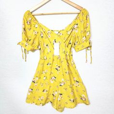 Beautiful Goldenrod Summertime Romper With A Delicate Floral Print. New With Tags --Material:Polyester --Approximate Flat Lay Measurements: Bust:13" Length:27" All Measurements Are Approximate A2 Spring Yellow Cotton Jumpsuits And Rompers, Fitted Yellow Jumpsuits And Rompers With Short Sleeve, Yellow Cotton Jumpsuits And Rompers For Spring, Yellow Fitted Jumpsuit With Short Sleeves, Fitted Yellow Jumpsuit With Short Sleeves, Yellow Jumpsuits And Rompers For Spring, Yellow Short Sleeve Jumpsuits And Rompers For Vacation, Yellow Floral Print Summer Jumpsuits And Rompers, Spring Yellow Jumpsuits And Rompers