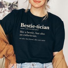 a woman wearing a black t - shirt with the words bestie - titian on it