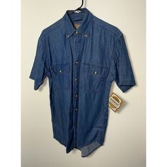 This C E Schmidt Workwear Men’s Button-Down Shirt Is A Must-Have For Your Work Wardrobe. Men Small ,20 Inches Pit To Pit And 27 Inches Shoulder To Waist . The Shirt Features A Solid Pattern, Long Sleeves, And A Collared Neckline With A Button-Down Closure. Made With 100% Cotton Denim Fabric, This Shirt Is Comfortable And Durable For Everyday Wear. The Shirt Is Accented With Buttons And Comes In A Vintage Blue Color. It Has Easy Care And Pockets Features, Making It Practical For Workwear. Availab Workwear Men, Wardrobe Men, Blue Button Down Shirt, Mens Workwear, Solid Pattern, Work Wardrobe, Unique Items, Schmidt, Denim Fabric