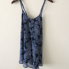 This Dress Is Perfect For Summer. It's Flowy And Has A Detailed Paisley Pattern. Blue Paisley Print V-neck Dress, Blue V-neck Dress With Paisley Print, Paisley Print Sundress Mini Dress, Summer Blue Paisley Print Dress, Blue Paisley Print Sundress, Spring Blue Paisley Print Dress, Casual Blue Mini Dress With Paisley Print, Casual Blue Paisley Print Mini Dress, Bohemian Blue Mini Dress With Paisley Print