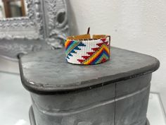 White Handwoven Adjustable Bracelets, Artisan White Cuff Bracelet As Gift, Adjustable White Beaded Bracelets, Unique Adjustable White Beaded Bracelets, White Adjustable Unique Beaded Bracelets, Artisan White Cuff Bracelet Gift, Adjustable White Handwoven Bracelets, Unique White Bracelets For Festivals, Adjustable Multicolor Jubilee Cuff Bracelet