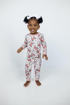 Introducing the "Love on Wheels" 2-Piece Set from our "Valentine's Day" collection, meticulously tailored for kids aged 2T to 7/8. Envelope your children in the snugness and flair of these enchanting pajamas, brimming with affection. Key Features: Ultra-Soft Fabric: Crafted from the finest bamboo fabric, our pajamas are unrivaled in softness, offering serene sleep and comfortable relaxation all day long. Easy Wear: Comprising a cozy top and matching bottoms, our set is designed for effortless dressing, streamlining nightly routines. Whimsical Design: Featuring an exclusive pattern of cozy coupes and hearts, "Love on Wheels" brings a playful and loving twist to bedtime attire, ideal for both boys and girls. Lasting Quality and Care: These pajamas are built to last through every childhood es Cute Pink Holiday Sets, Playful Fitted Sets For Sleepovers, Playful Pink Sets For Holiday, Playful Pink Holiday Sets, Playful Matching Bedtime Set, Playful Matching Bedroom Set, Family Matching Sets For Playtime, Playful Christmas Playtime Clothing Sets, Playful Long Sleeve Holiday Sets