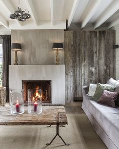 a living room filled with furniture and a fire place